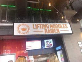 Lifting Noodles Ramen inside