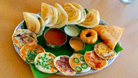 Rava Masala Dosa, 1 Pc Idli, 2Pc Vadas With Sambher And Chutneys.