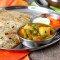 2 Pcs Paneer Paratha Aloo Matar Gravy