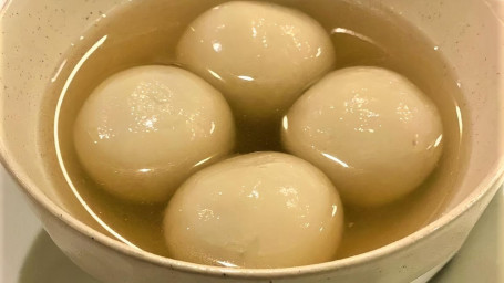 Black Sesame Dumplings Served In Ginger Soup.